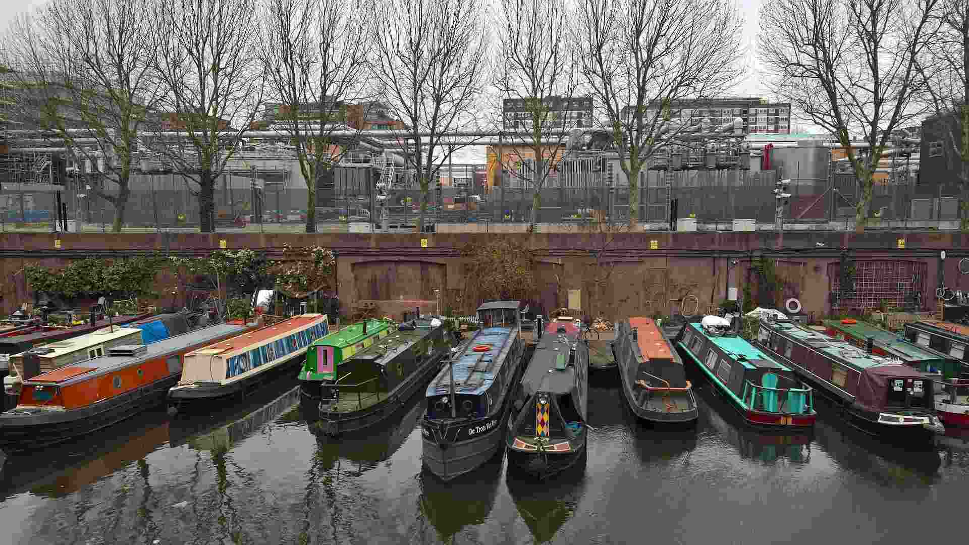 group of narrowboats docked at marina