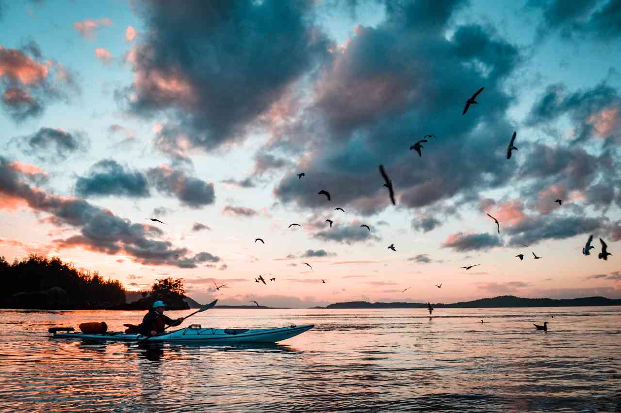 kayaking at sea during sunset