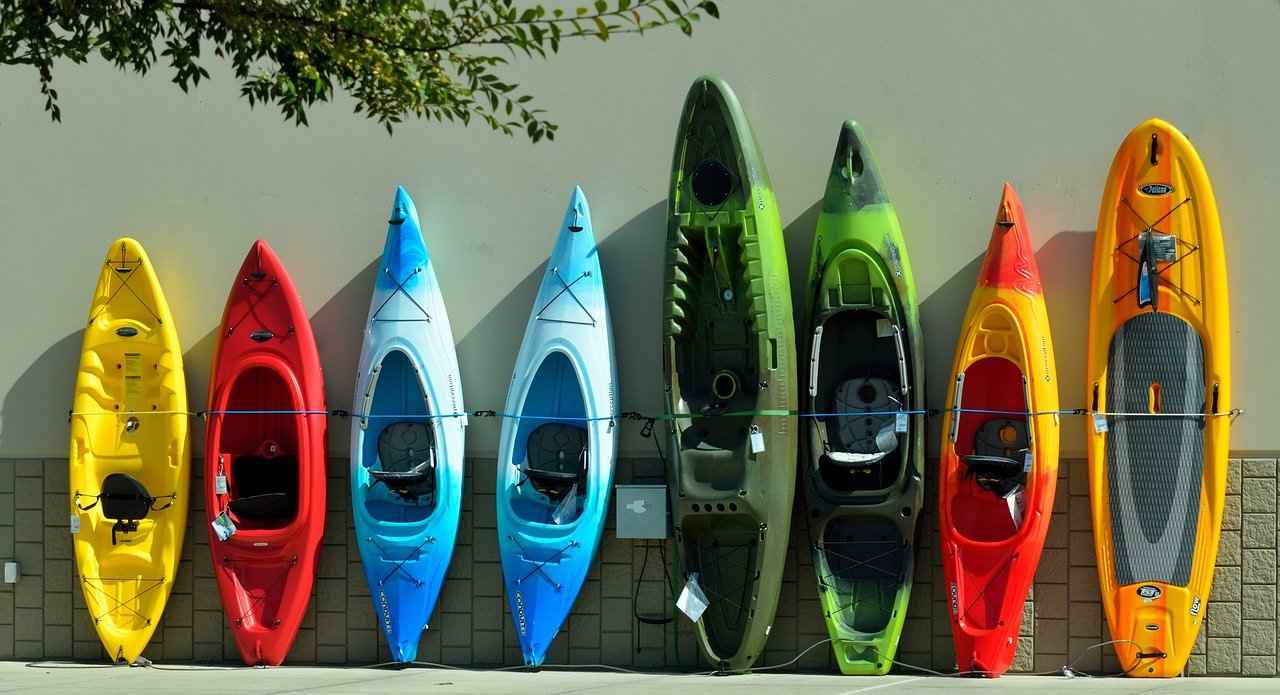 line of kayaks against wall