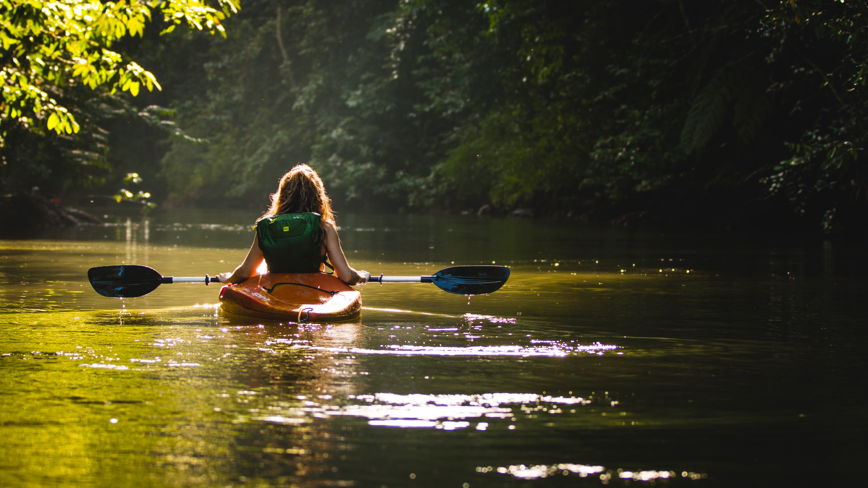 woman paddling in canoe