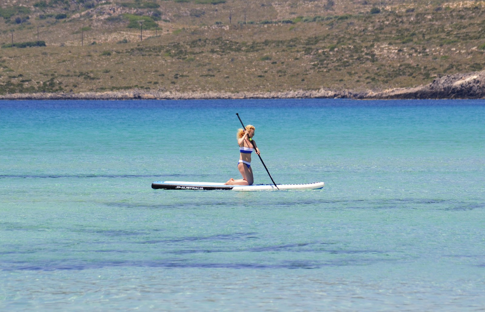 woman paddle boarding