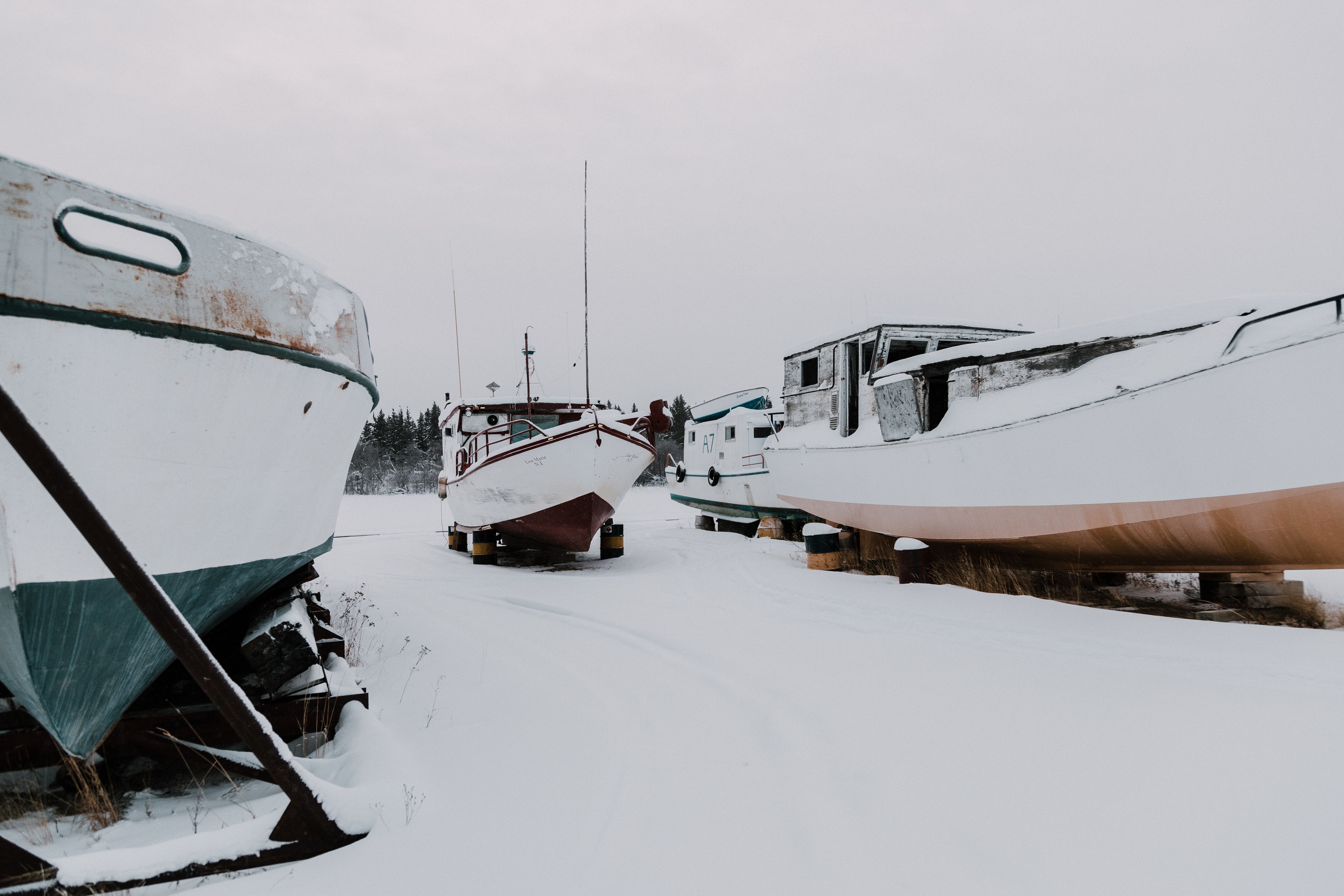 three boats in snow