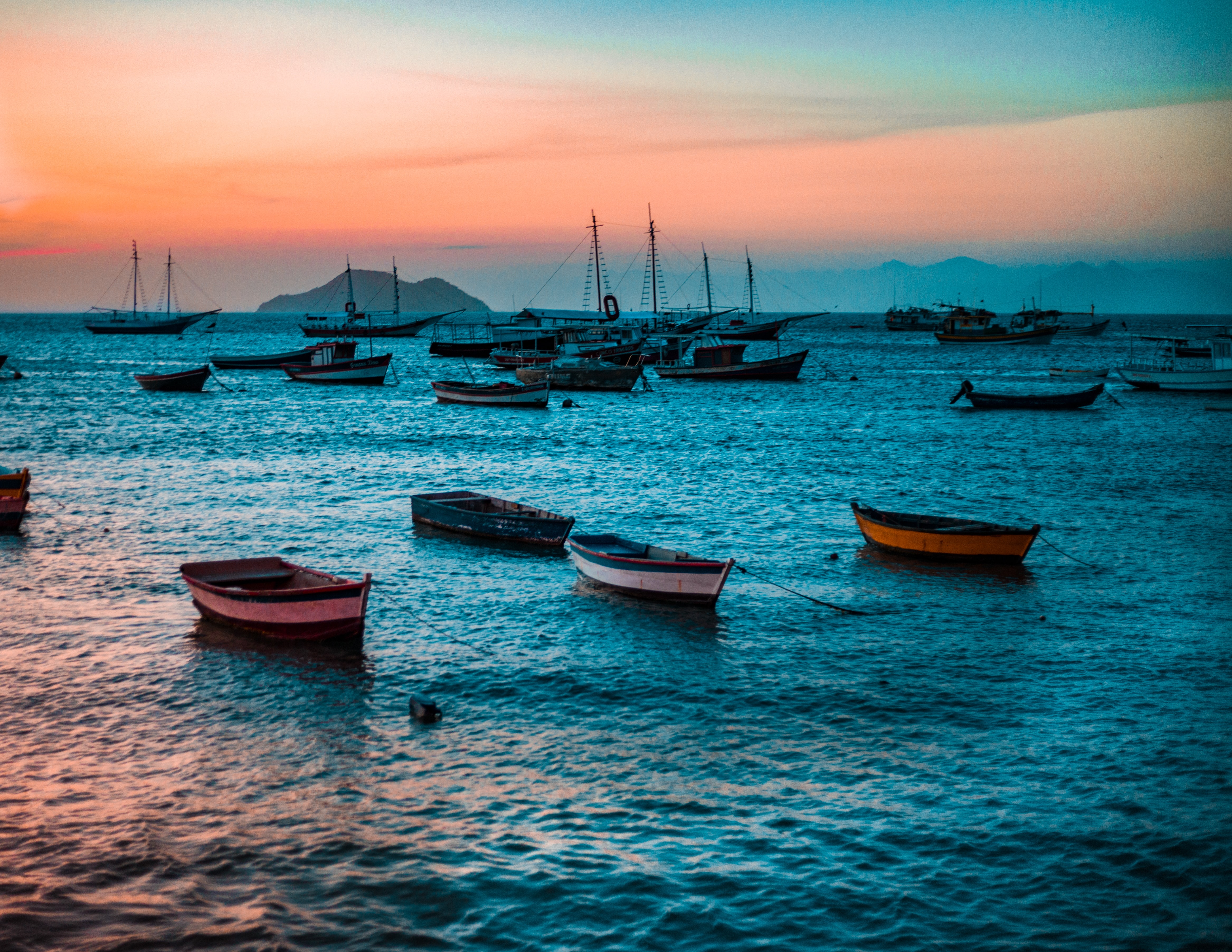 boats on the water during sunset